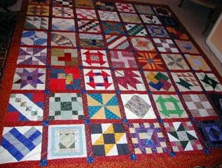 Suzanne's completed NiftyFifty quilt — all 50 state blocks