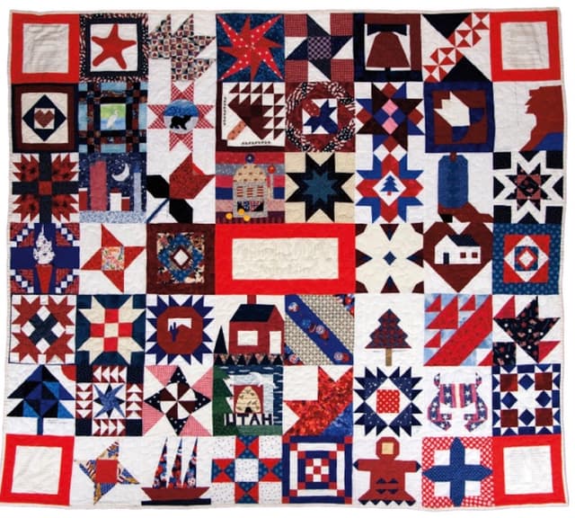 Published photo of the NF I Breast Cancer Charity quilt in 2018 in "Quilts and Health" by Marsha Macdowell.